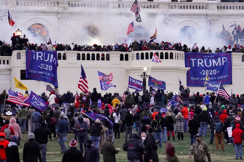 In this Wednesday, Jan. 6, 2021, file photo, violent rioters supporting President Donald Trump, storm the Capitol in Washington. A participant in the Jan. 6, 2021 attack on the U.S. Capitol was taken into custody Thursday, Dec. 22, 2022, in Southern California after an hours-long standoff, authorities said.